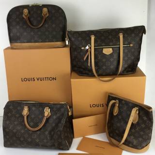 A collection of Louis Vuitton handbags 